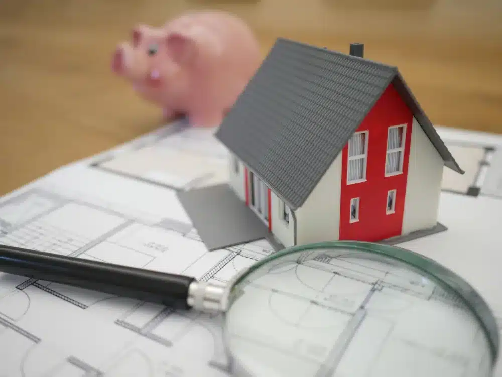 House and piggy bank representing hidden assets
