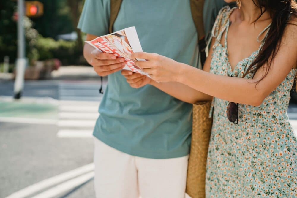 Tourists consulting a map while traveling in a new city.